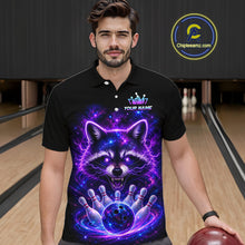 Load image into Gallery viewer, A man wearing a black short-sleeve polo shirt with a vibrant purple and blue neon raccoon graphic on the front, standing in a bowling alley. The shirt features a custom name placeholder and a visible 'Chipleamz.