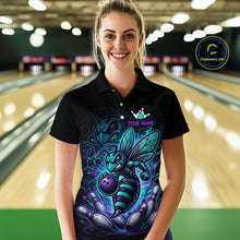 Load image into Gallery viewer, Woman wearing a black bowling quarter zip with teal and purple bee graphics, custom team text, bowling pins, and a purple bowling ball.