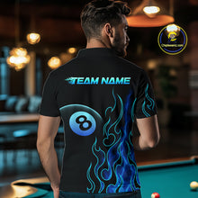 Load image into Gallery viewer, Men wearing billiards polo shirt featuring an eight ball design surrounded by flowing blue flame graphics on a black background.
