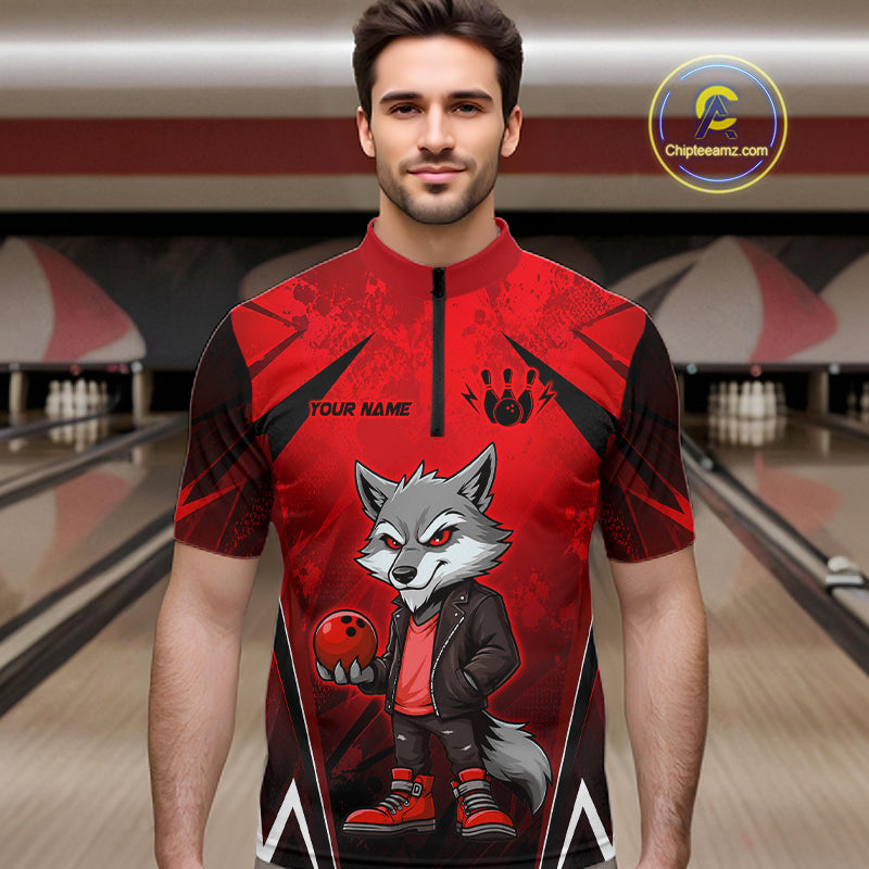 Man wearing a red and black bowling quarter zip shirt featuring a gray wolf mascot holding a red bowling ball, with custom player name text.