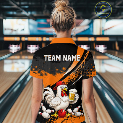 Woman wearing a orange and black bowling quarter zip featuring a chicken holding a beer mug, red bowling ball, scattered pins, and custom team name text.
