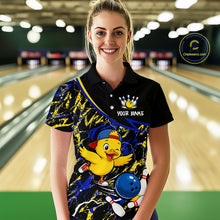 Load image into Gallery viewer, Person wearing a colorful bowling shirt with a cartoon character in a bowling alley.