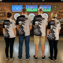Load image into Gallery viewer, Four people beige and black darts polo featuring a bald eagle, torn-flag graphics, dartboard designs, and custom team text.