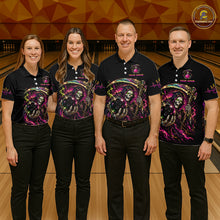 Load image into Gallery viewer, Four people wearing matching black shirts with colorful designs in a bowling alley.
