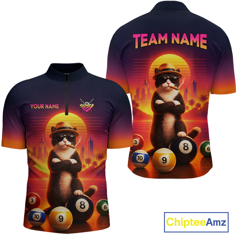 Front and back views of a short-sleeve quarter-zip performance shirt featuring a colorful graphic of a cat wearing sunglasses and a hat, posed with billiard balls in front of a sunset and city skyline. The front has placeholder text 'YOUR NAME' and a small logo, while the back displays 'TEAM NAME'.