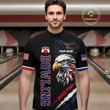 Load image into Gallery viewer, Man wearing a black bowling shirt with eagle design and text in a bowling alley.