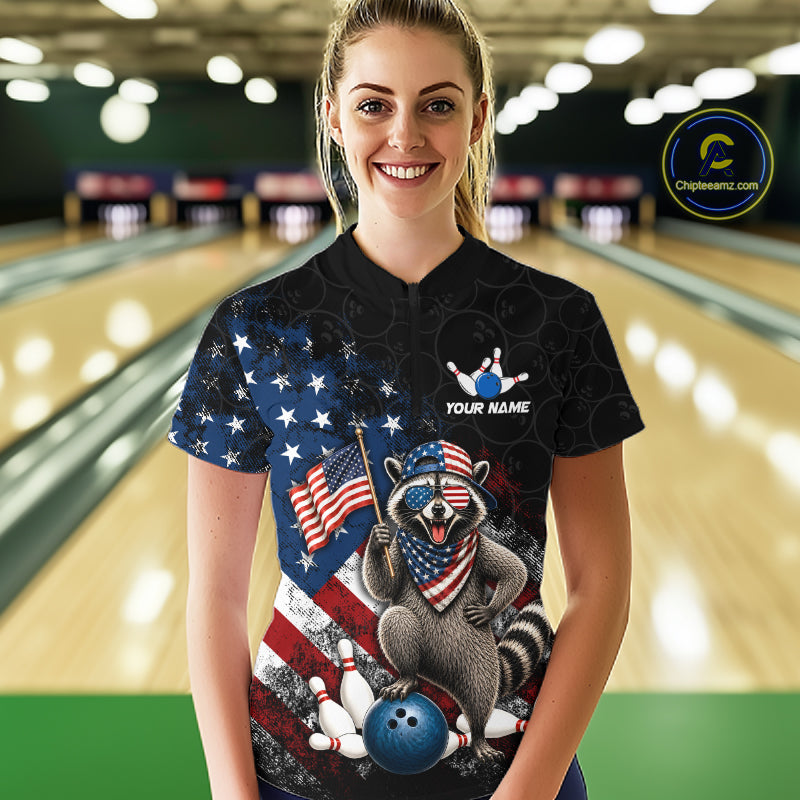 Women’s us flag raccoon bowling quarter zip shirt, front view on female model in bowling lane 
