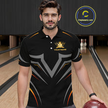 Load image into Gallery viewer, Man wearing a black bowling shirt with a logo and text in a bowling alley.