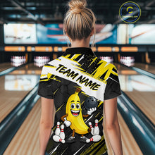 Load image into Gallery viewer, Women wearing a bowling-themed shirt with a cartoon banana character in a bowling alley.