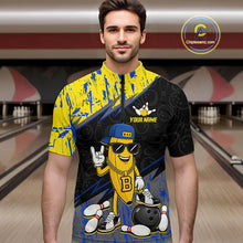 Load image into Gallery viewer, Man wearing a colorful bowling shirt with cartoon character design in a bowling alley.