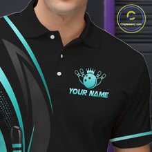 Load image into Gallery viewer, Black polo shirt with a bowling ball and lane logo and 'Your Name' text, worn by a person.