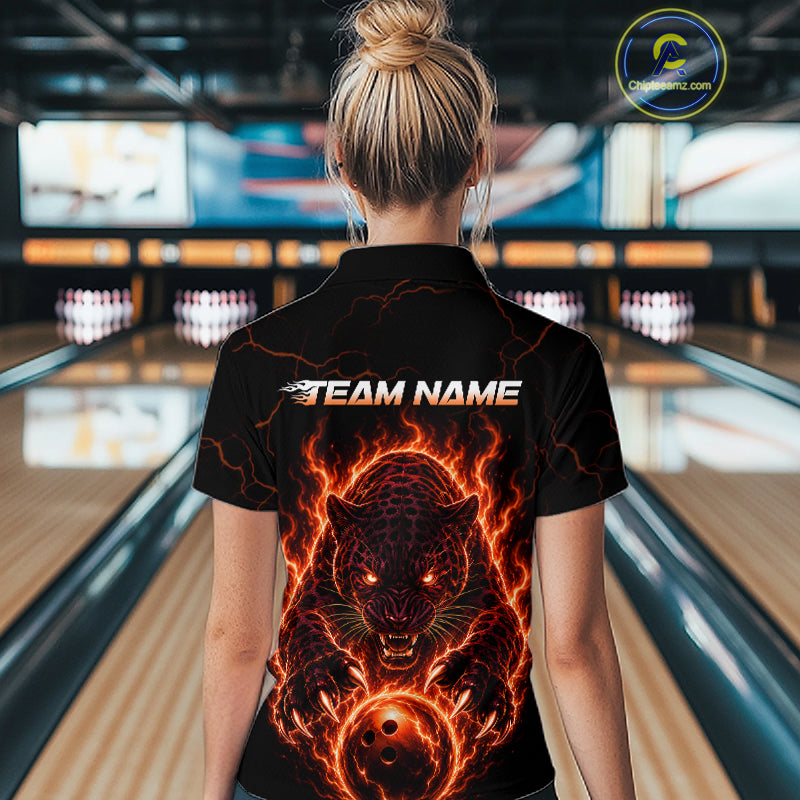 Person wearing a black t-shirt with fiery panther design and 'TEAM NAME' text in a bowling alley.