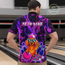 Load image into Gallery viewer, Man wearing a black and purple bowling polo shirt featuring a cartoon dachshund wearing sunglasses and a crown, holding a pink bowling ball, with custom team name text.
