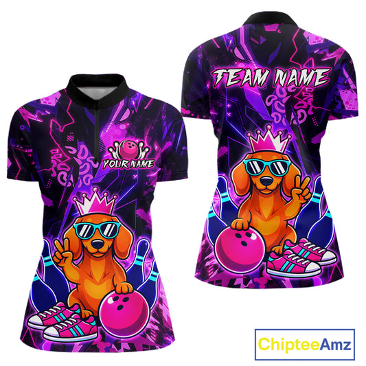 Front and back views of a black and purple bowling quarter zip shirt featuring a cartoon dachshund wearing sunglasses and a crown, holding a pink bowling ball, with custom team and player name text.