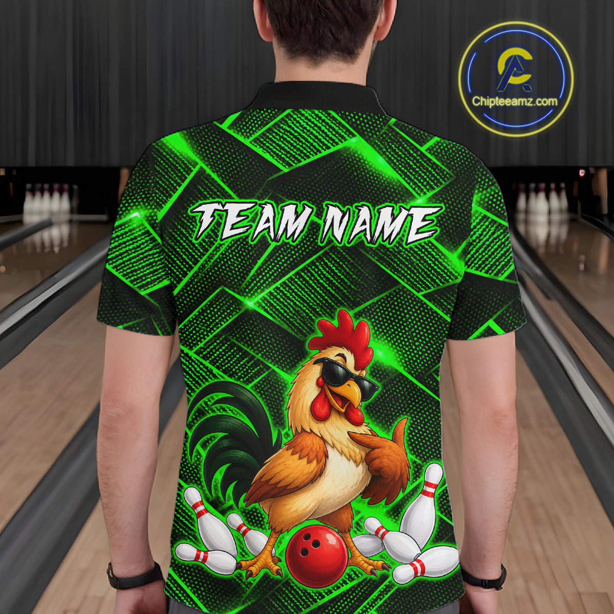 Man wearing a green and black bowling polo shirt featuring a cool rooster mascot wearing sunglasses, a red bowling ball, bowling pins, and custom team name text.