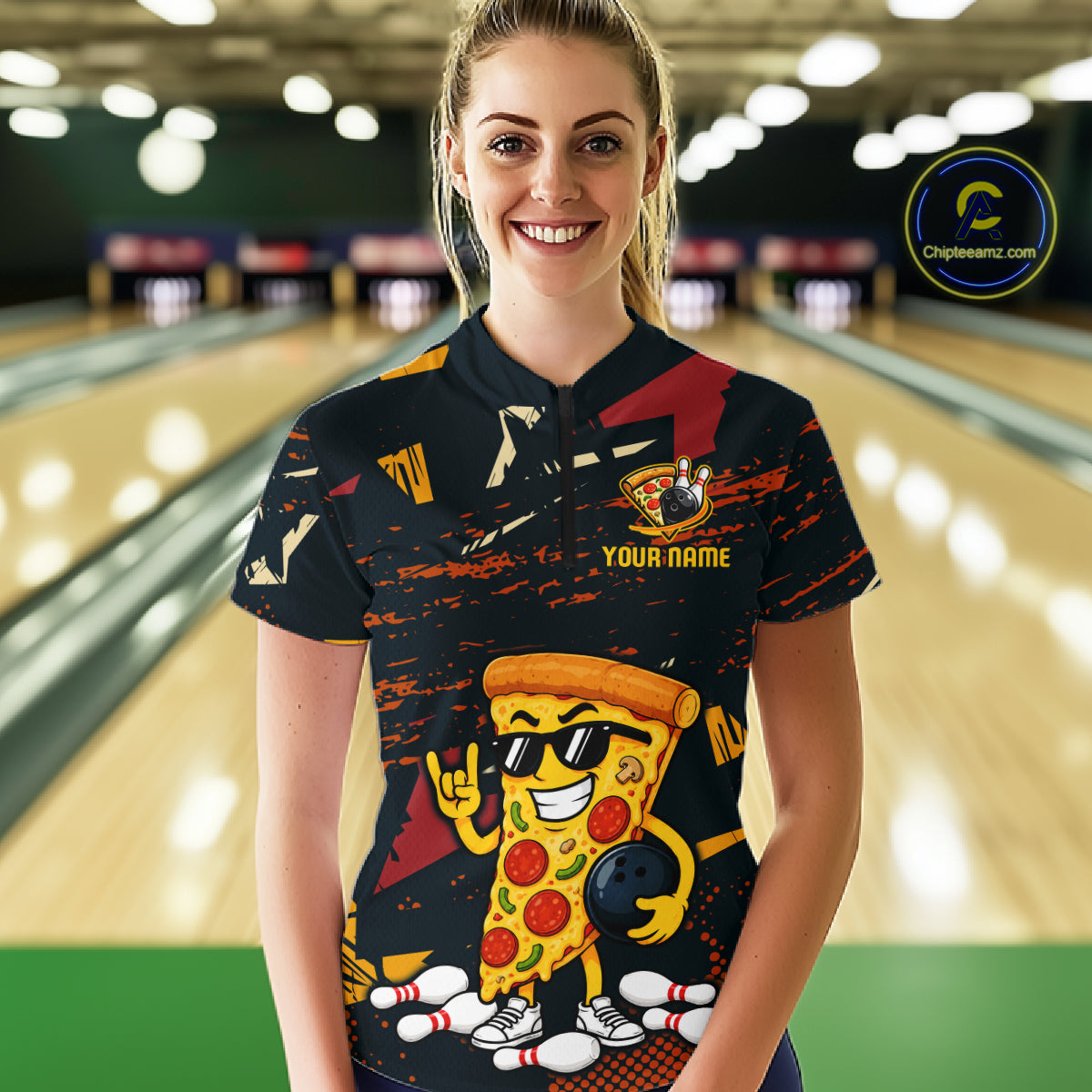 Woman wearing a black bowling quarter zip featuring orange grunge graphics, a sunglasses-wearing pizza slice mascot, bowling pins, and custom your name text.