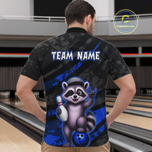 Load image into Gallery viewer, Person wearing a bowling-themed shirt with a raccoon graphic in a bowling alley.
