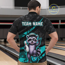 Load image into Gallery viewer, Person wearing a black bowling shirt with a raccoon graphic and 'Team Name' text in a bowling alley.