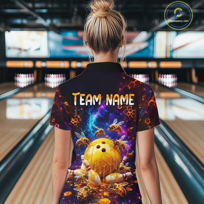 Woman wearing of a dark bowling quarter zip with cosmic honeycomb graphics, bees, honey-dripping bowling balls, pins, and custom team name text.