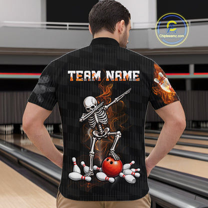 A man viewed from behind wearing a black bowling-themed short-sleeve button-up shirt with a large skeleton and bowling ball graphic on the back, standing in a bowling alley.