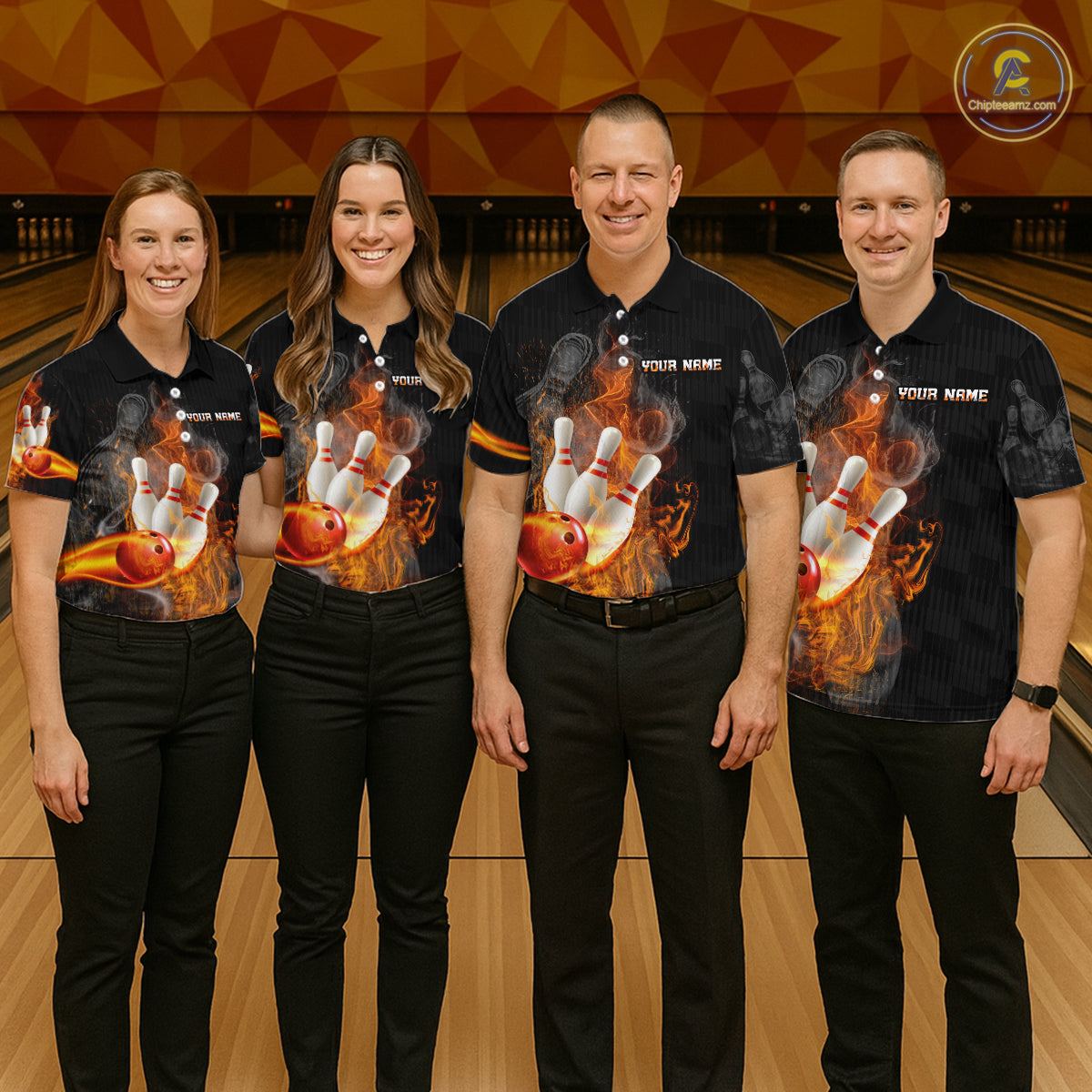 Four people standing together in a bowling alley wearing matching black short-sleeve bowling shirts with a large bowling pin and ball flame graphic on the front, paired with black pants.