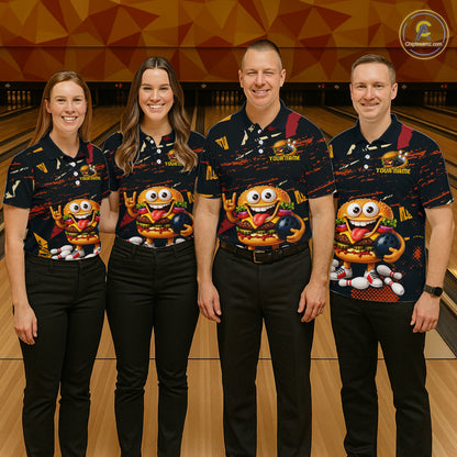 Four people standing in a bowling alley wearing matching dark navy bowling shirts with a large cartoon character graphic on the front, paired with black pants. The shirts have bowling-themed print details and the background shows bowling lanes and a geometric orange wall.