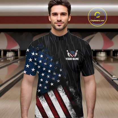 Man wearing a black patriotic bowling quarter zip shirt featuring distressed American flag graphics, custom team and player name text, and a bald eagle with spread wings above a flag-themed bowling ball and pins.