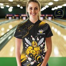 Load image into Gallery viewer, Women wearing bowling quarter zip shirt featuring a muscular bee holding a bowling ball surrounded by pins on black yellow background.