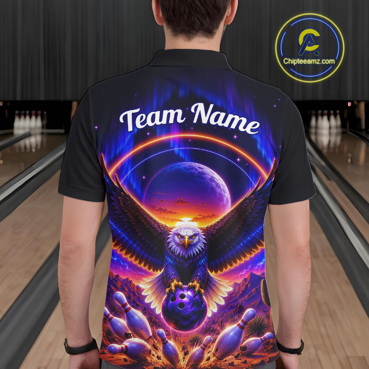 Man wearing a black bowling quarter zip with a eagle, glowing planet backdrop, bowling pins, and custom player name text.