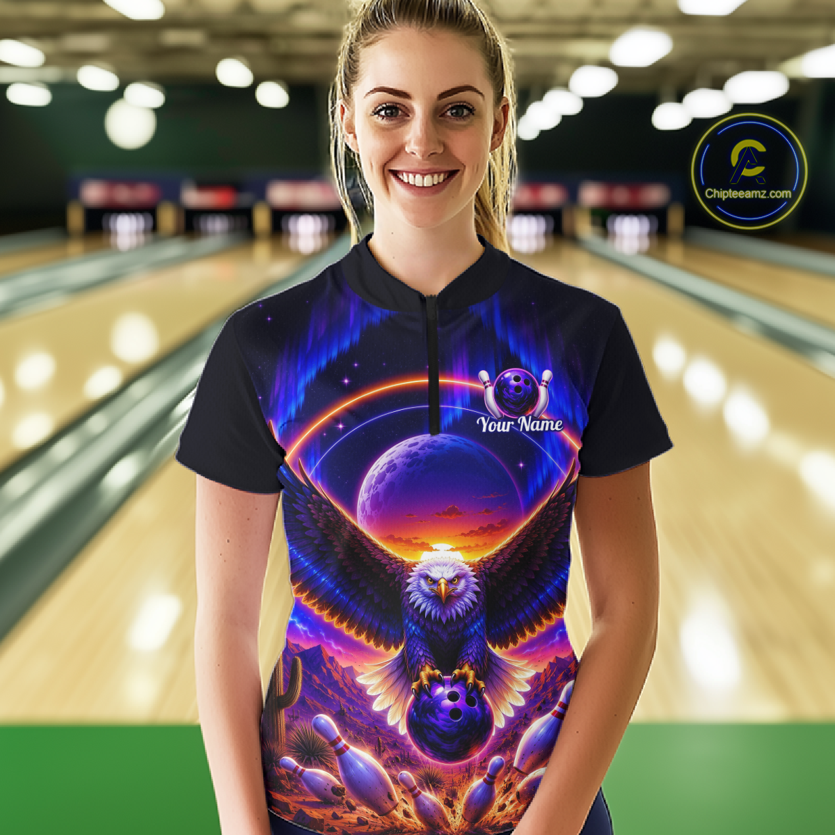 Woman wearing a black bowling quarter zip with a eagle, glowing planet backdrop, bowling pins, and custom team and player name text.