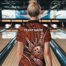 Load image into Gallery viewer, Women personalized bowling polo shirt with bowling balls and pins arranged within orange polynesian tribal patterned artwork across a dark layout.