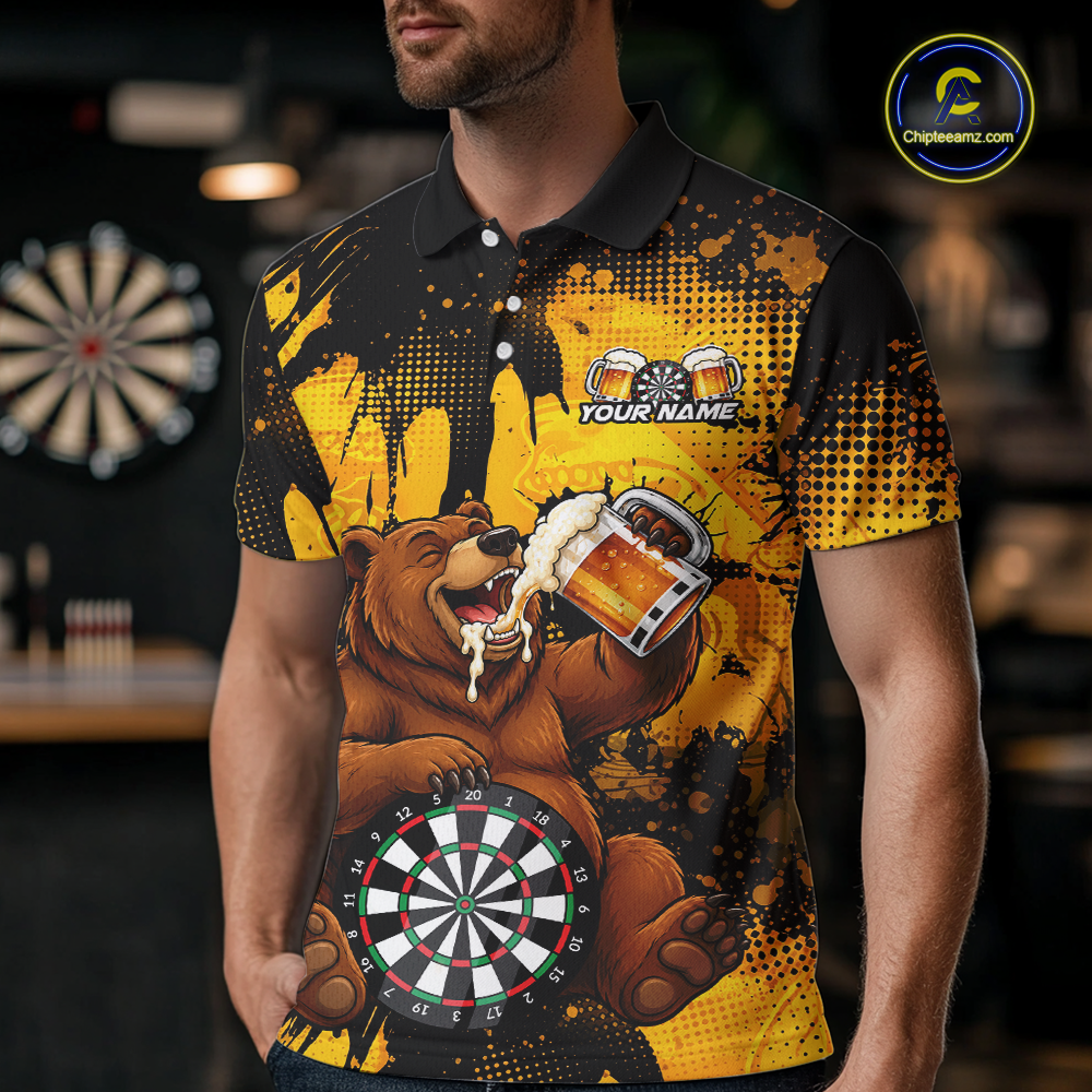 Man wearing a black and yellow darts polo featuring a bear drinking beer, dartboard graphics, and custom team and player name text.