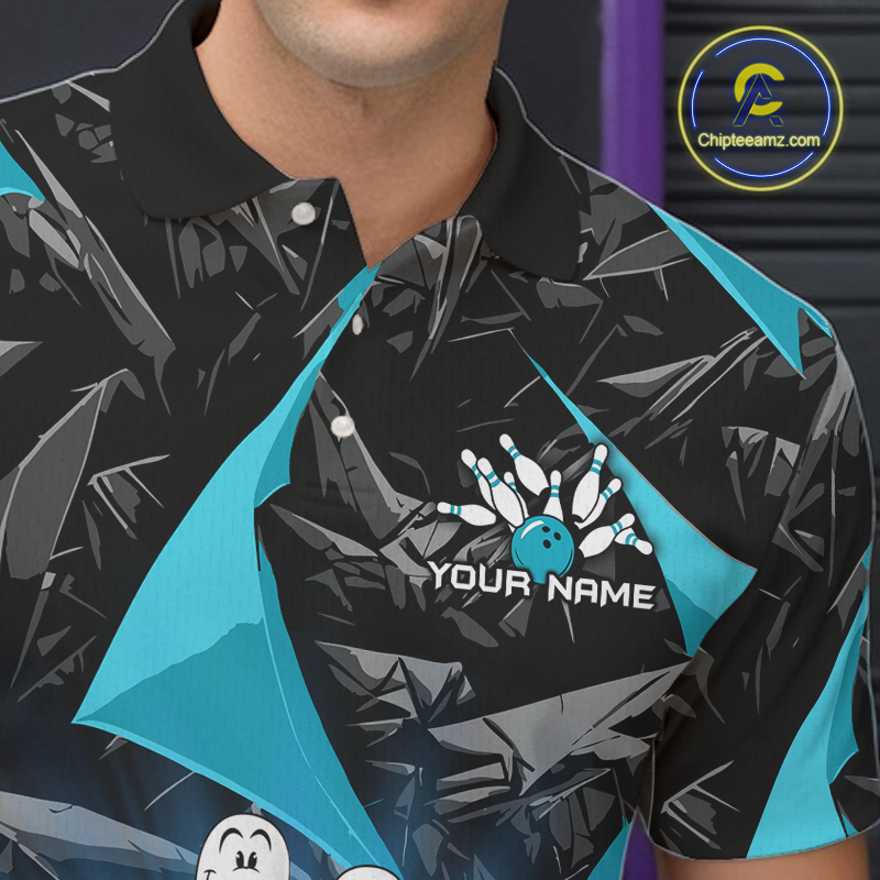 A close-up of a person wearing a short-sleeve polo shirt with a black and dark gray abstract pattern, bright turquoise side panels, and a bowling-themed chest graphic that reads 'YOUR NAME' with bowling pins and a bowling ball.