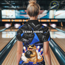 Load image into Gallery viewer, Women’s blue bearded dragon bowling quarter zip shirt, back view on female model in bowling lane 