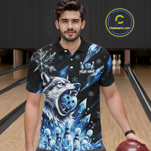 Load image into Gallery viewer, Man wearing a black polo shirt with a blue wolf design in a bowling alley.