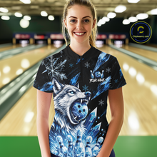 Load image into Gallery viewer, Woman wearing a black bowling shirt with a blue wolf design in a bowling alley.