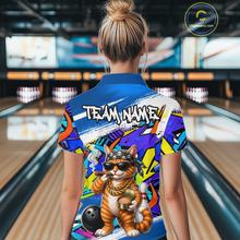 Load image into Gallery viewer, Woman wearing a colorful bowling shirt with a cat design in a bowling alley.