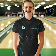 Load image into Gallery viewer, Woman wearing a black bowling shirt with teal accents in a bowling alley.