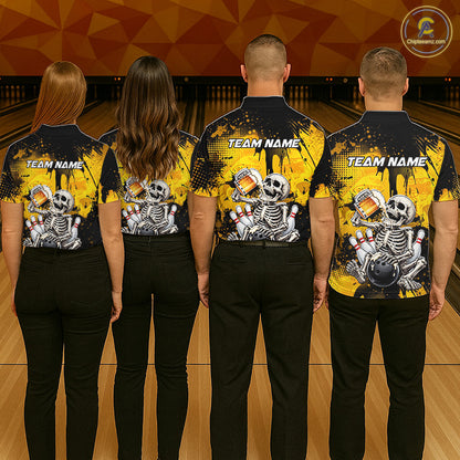 Four people standing in a bowling alley, viewed from behind, wearing matching black and yellow bowling shirts with a skeleton and bowling pins graphic on the back. The shirts have 'TEAM NAME' printed on the upper back.