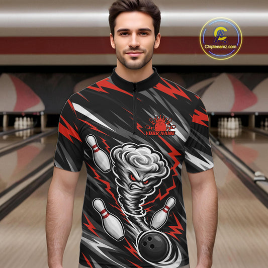 A man wearing a custom bowling-themed short-sleeve quarter-zip shirt with a black, red, and gray tornado graphic, standing in a bowling alley. 