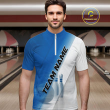 Load image into Gallery viewer, Male model front view in a bowling lane wearing a bowling quarter zip shirt with bowling ball and pins across a blue and white diagonal layout.