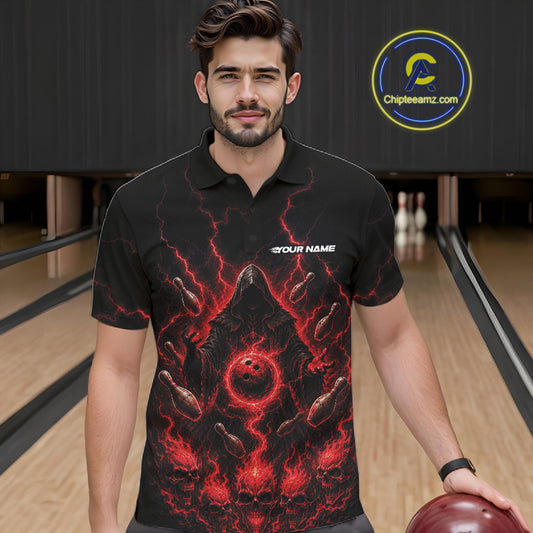 A man wearing a black short-sleeve polo shirt with a red and black lightning-bolt grim reaper graphic, standing in a bowling alley holding a bowling ball. 