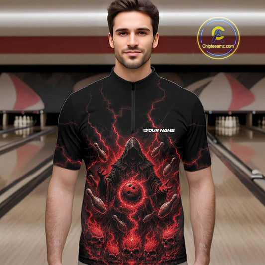 A man wearing a black short-sleeve quarter zip bowling jersey with a red and black lightning-bolt bowling ball graphic on the front, standing in a bowling alley. 