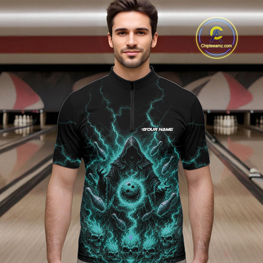 A man wearing a black short-sleeve quarter-zip bowling jersey with a glowing teal lightning and bowling ball graphic, standing in front of a blurred bowling alley background. 