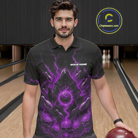 A man wearing a black short-sleeve polo shirt with a purple and black flame girm reaper graphic, standing in a bowling alley holding a bowling ball. 