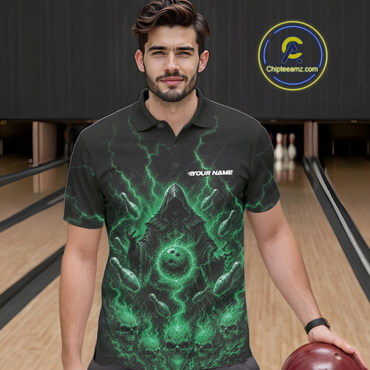 A man wearing a black short-sleeve polo shirt with a green grim reaper graphic, standing in a bowling alley holding a bowling ball. Halloween bowlers outfit