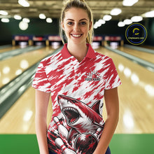Load image into Gallery viewer, Woman wearing a red and white polo shirt with a shark design in a bowling alley.