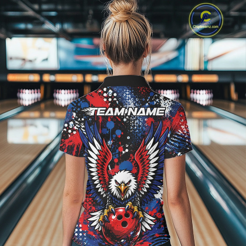 Female model showcasing the back design of a custom red, white, and blue patriotic eagle women's bowling polo shirt with a customizable "TEAM NAME" text template inside a bowling alley.