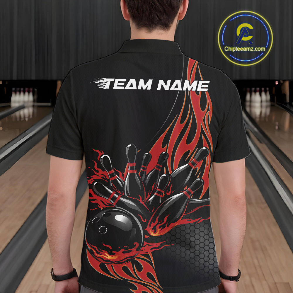 Back view of a male model in a bowling lane wearing a black polo shirt featuring red flaming black bowling ball striking pins with bold bowling visuals.