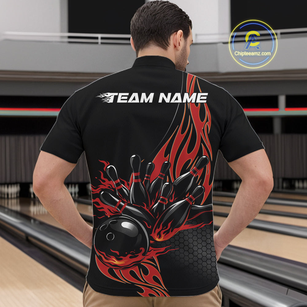 Front view male model at bowling venue wearing black quarter zip shirt showcasing red flame bowling ball striking pins in dynamic motion design.